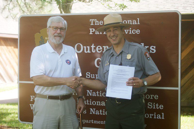 First Colony's Eric Klingelhofer and National Park Service's Dave Hallac look to continuing research at Fort Raleigh National Historic Site