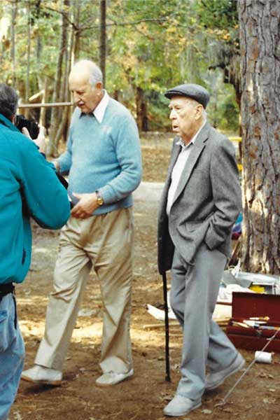 Ivor Noel Hume and J. C. Harrington confer at the Fort Raleigh site in 1991.